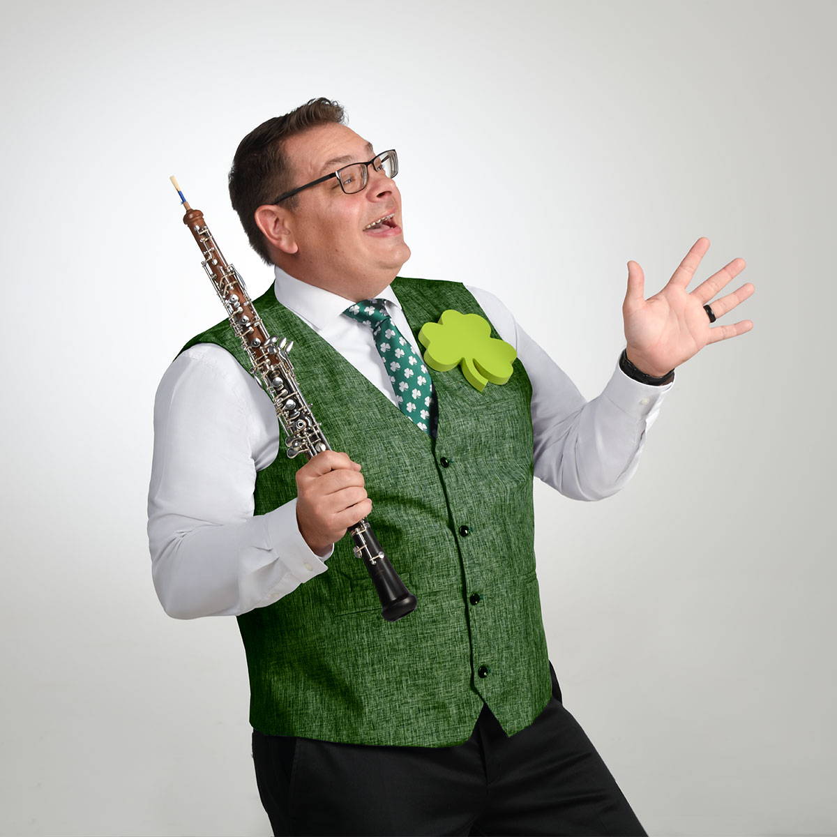 Oboist Nicholas Arbolino with a green vest and a green clover pin
