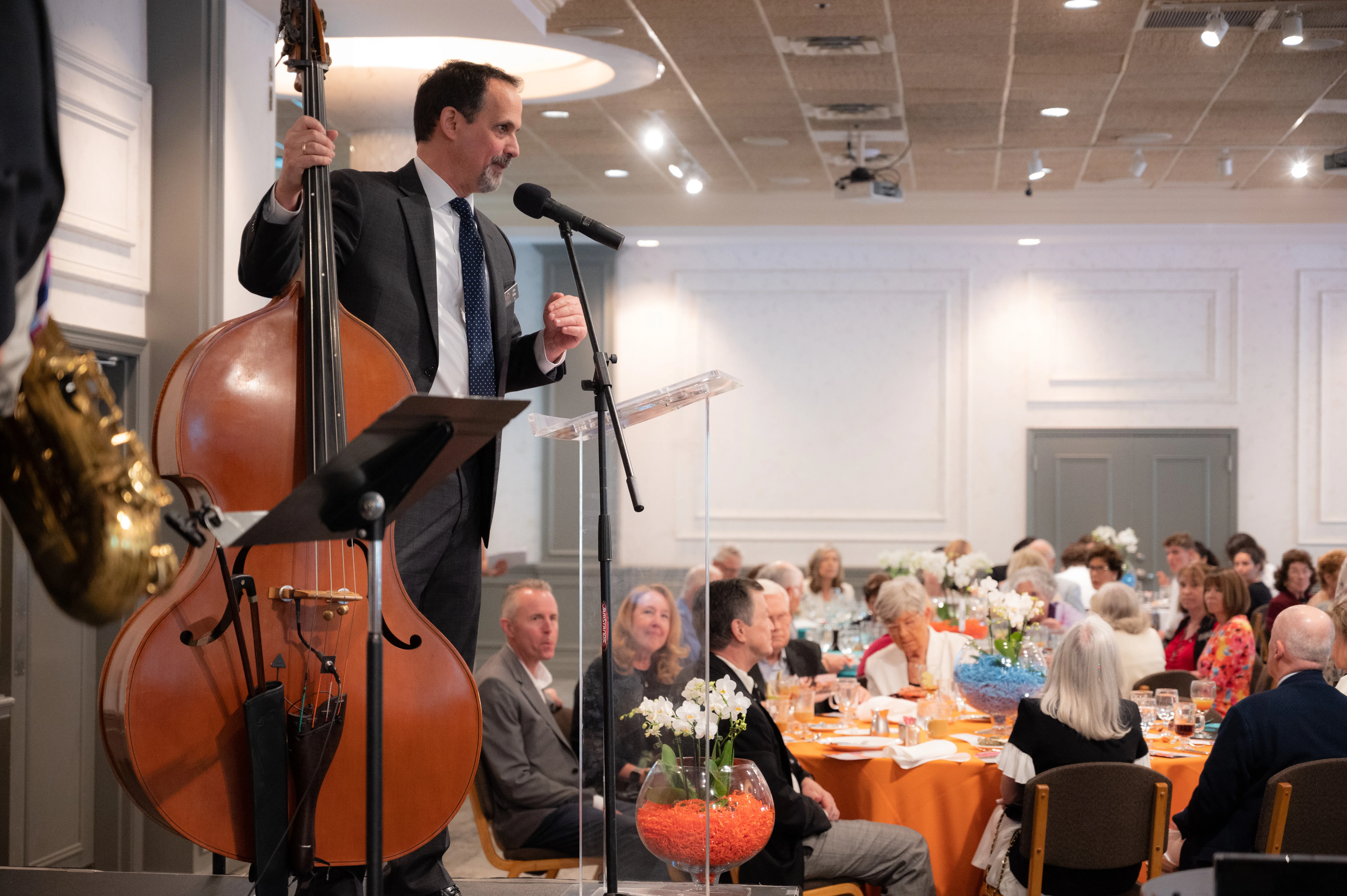 John Miller speaking to brunch audience